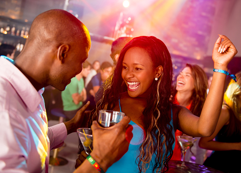 Dancing at nightclub wearing cloth wristbands